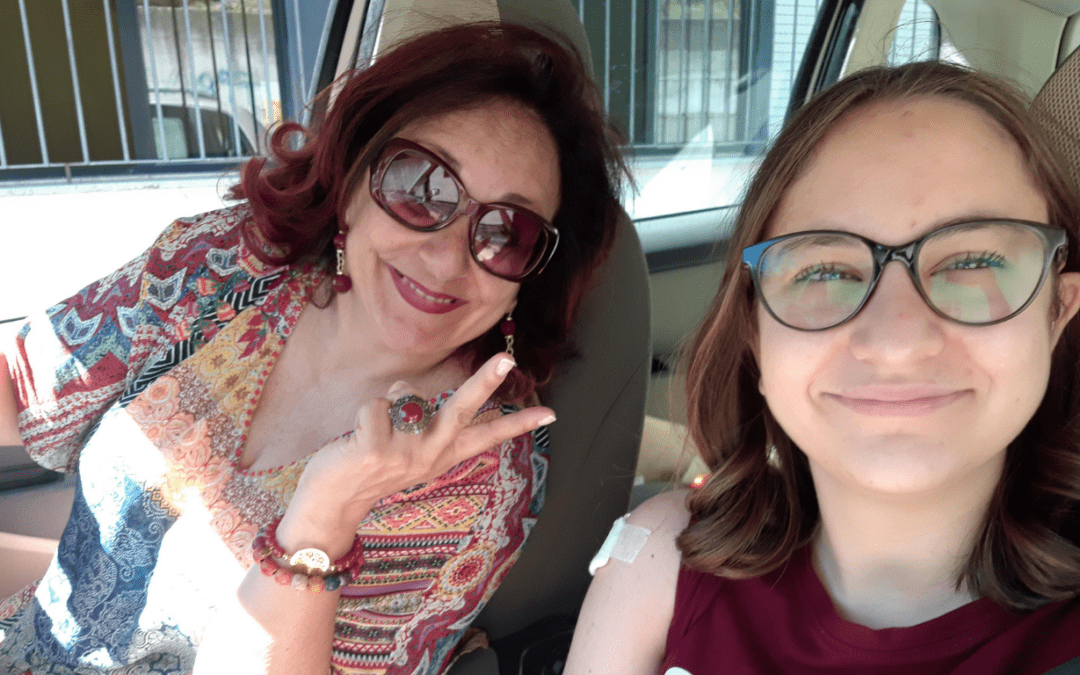 A smiling carer and NDIS participant in a car, enjoying a positive moment together NDIS Plan Management for carers